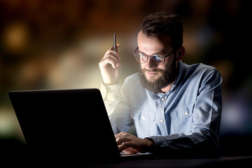 Businessman in the office at night