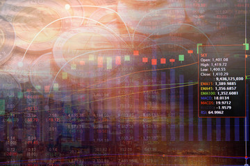 Double exposure money coins on trading graph and stock market board background with capital...