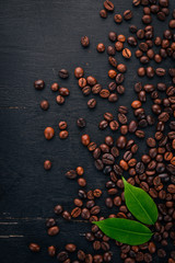 Coffee beans. On a wooden background. Top view. Copy space.