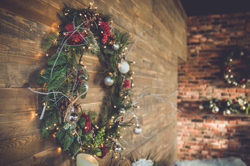 Round garland on a wooden wall on christmas and new year