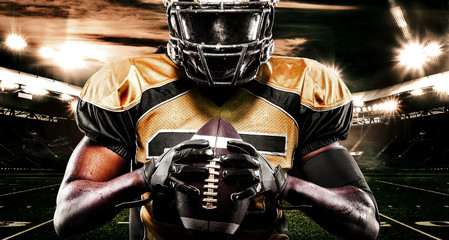 American football sportsman player on stadium. Sport wallpaper. © Mike Orlov