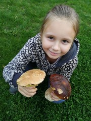 Litlle girl pick mushroom