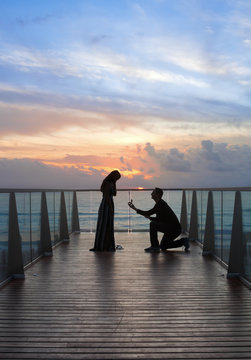 Proposal on beach at Sunset 