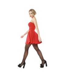 Young beautiful happy blonde woman in red dress
