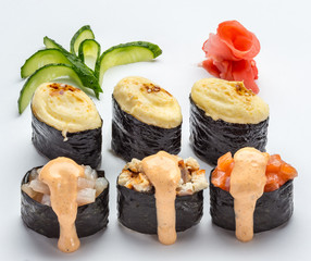 Sushi and roll set with seafood isolated on white background. Japanese cuisine.