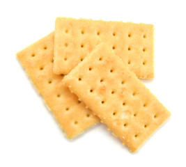 Salty crackers in square shape on white background