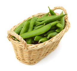 fresh green peas in basket isolated on a white background