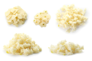 Set with raw fresh chopped garlic on white background
