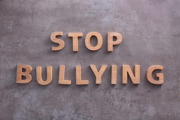 Text "Stop bullying" on grey background