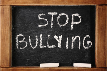 Chalkboard with text "Stop bullying", closeup