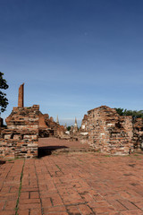 An spectacular view from Wat Mahathat with stones, pillars, walls and pavement which is ruined by aggressor in the past but still have an amazing condition.