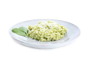 Plate with tasty spinach risotto on white background