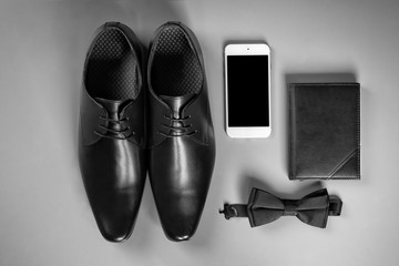 Composition with elegant leather men's shoes on grey background