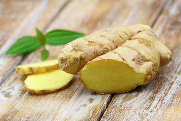 Fresh ginger on rustic wooden surface
