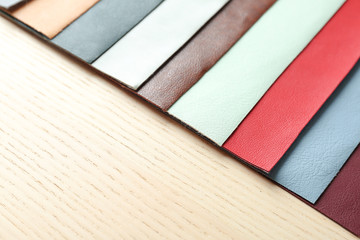 Fototapeta na wymiar Colorful fabric samples on wooden background