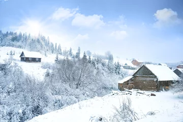 Fotobehang View of mountain village in snowy countryside on winter day © Africa Studio