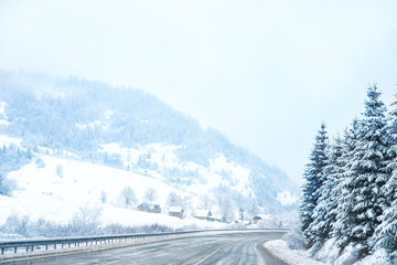 Fototapeta premium Country road in snowy winter day