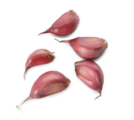 Garlic cloves on white background