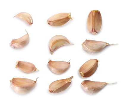 Composition with garlic cloves on white background