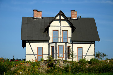 Old renovated white house in the countryside