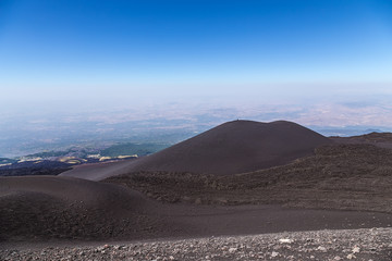 Fototapeta na wymiar The volcano of Etna, Sicily, Italy. Frozen lava flows and lateral craters