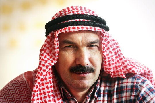 Serious arab man in arab kerchief