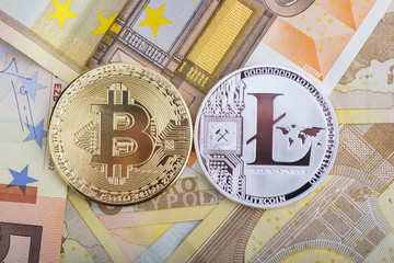Bitcoin and laitcoin on money background