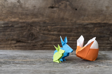 Fototapeta na wymiar Three Origami Easter Rabbits with Egg