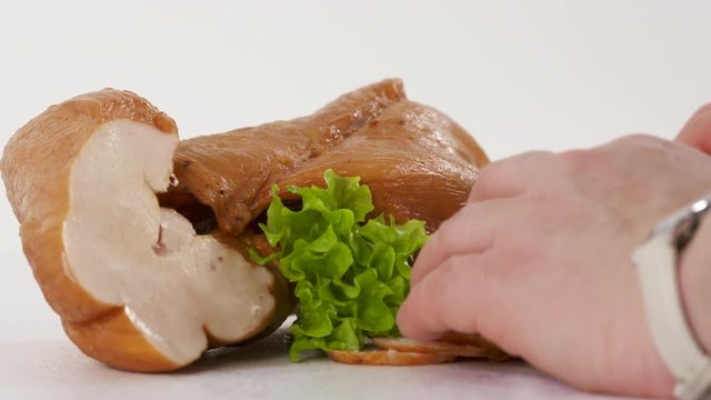 The process of food photography. Processed meat products. Photographer arranges food to create attractive still life pictures. Smoked chicken breast with herbs.