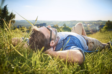 Man relaxing during hiking trip in the mountains
