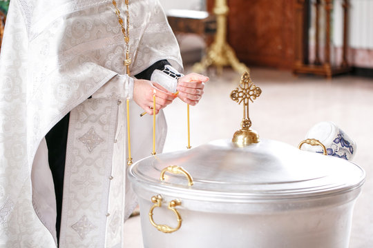 baptismal font. Accessories for the christening of children icons of candles, the Ortodox Church. The Sacrament of Children