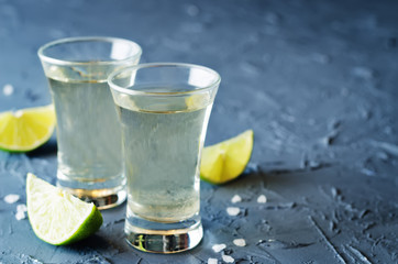 Tequila in glasses with lime and salt