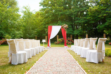 beautiful wedding arch with chairs