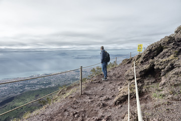 Man standing on the top of Vesuvio volcano