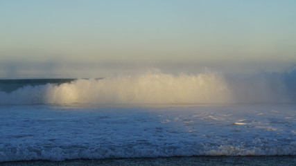 dawn wave in the mist