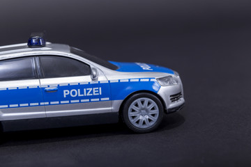 Police car in black background
