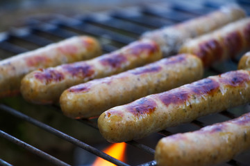 German sausages on the grill, outdoor barbecue 