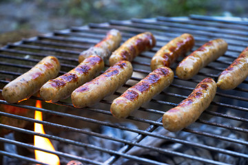 German sausages on the grill, outdoor barbecue 