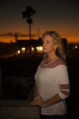 woman in deep thought at sunset