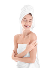 Attractive young woman in towel on white background