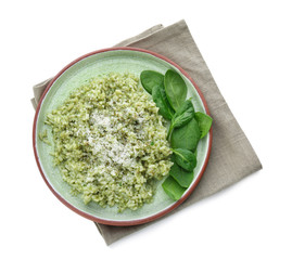 Plate with delicious spinach risotto on white background