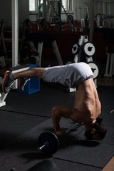 Athlete Exercising Push-Ups On Barbell In Elevation Mask
