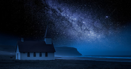 Small church on the beach at night with stars, Iceland