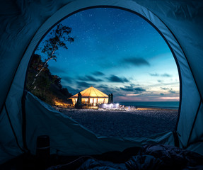 Fototapeta na wymiar Tent at beach in summer at night with stars