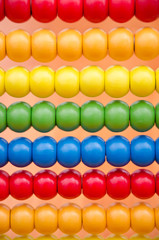 Closeup of wooden abacus with colourful beads