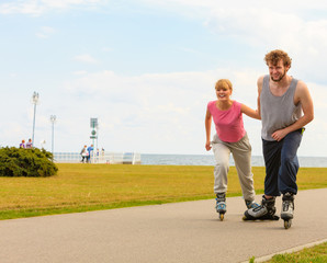 Obraz premium roller skater couple skating outdoor