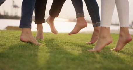 Group of emthusiastic people celebrating life by joyfully jumping up and down - Powered by Adobe