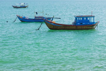 Fototapeta na wymiar Fishing Boats Turquoise Ocean Vietnam