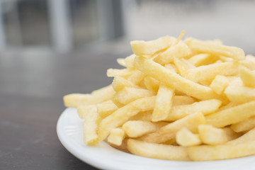 Golden potatoes fried on the white plate, french fried