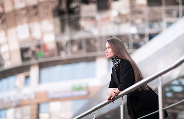 Portrait of confident business woman against a modern office building